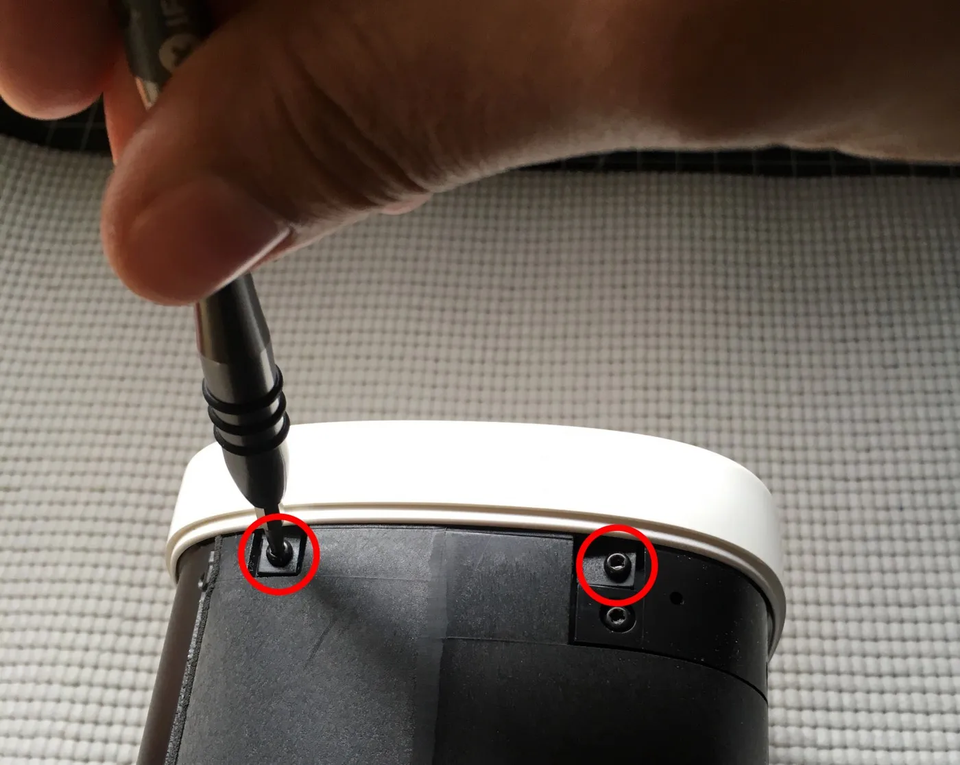 Removing the top cover's side screws