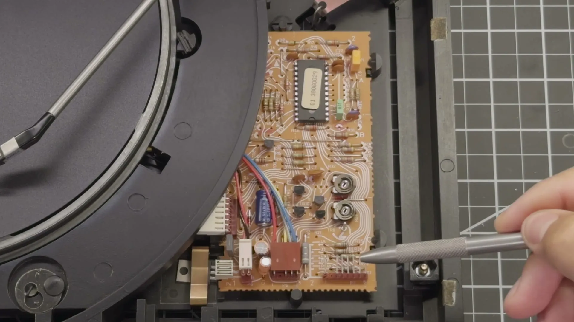 The turntable opened up, its original control board being probed