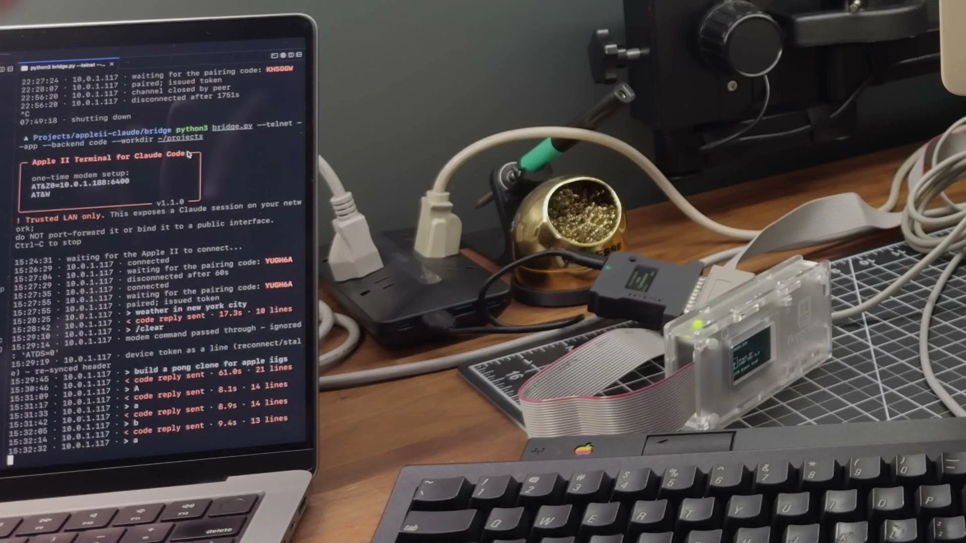 A laptop running the bridge, beside a Floppy Emu and the Apple IIgs keyboard