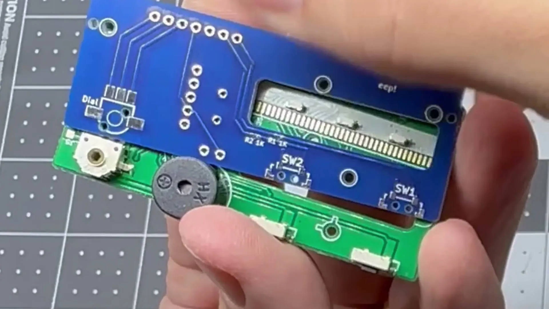 The new Macintosh Mini board laid over the clock's original board