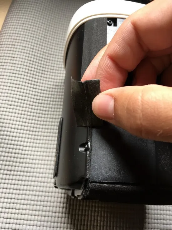 Peeling the foam tape off the side of the rear cover