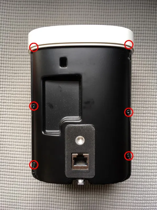 The rear cover's six screws, circled