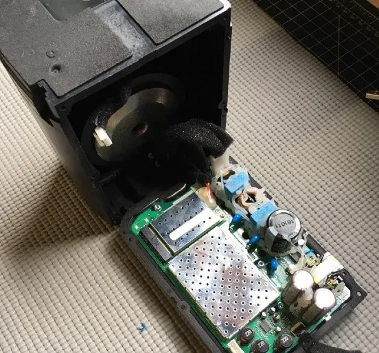 The rear cover folded down, with the main board inside it