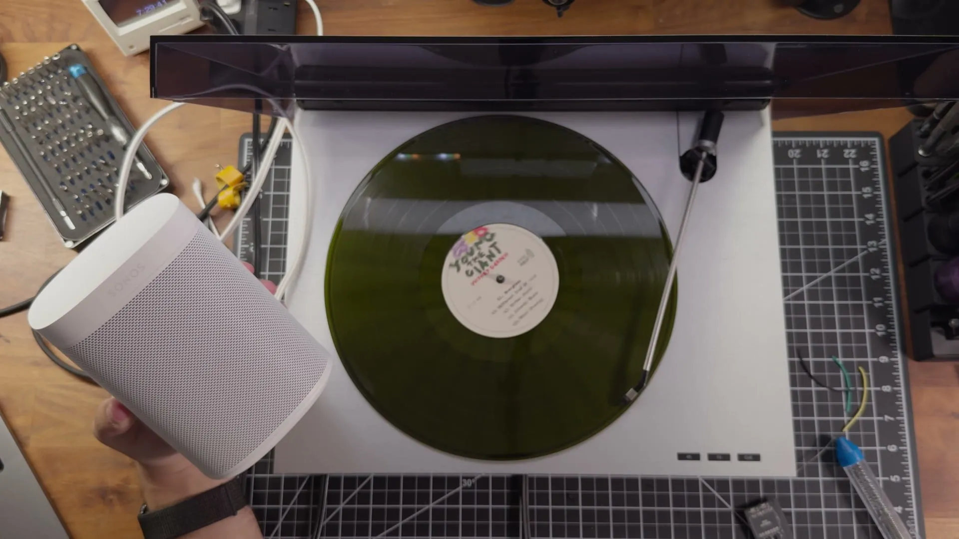 A record on the Beogram's platter, a speaker held beside it