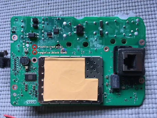 The main board's DC pads: positive for the red wire, negative for the black