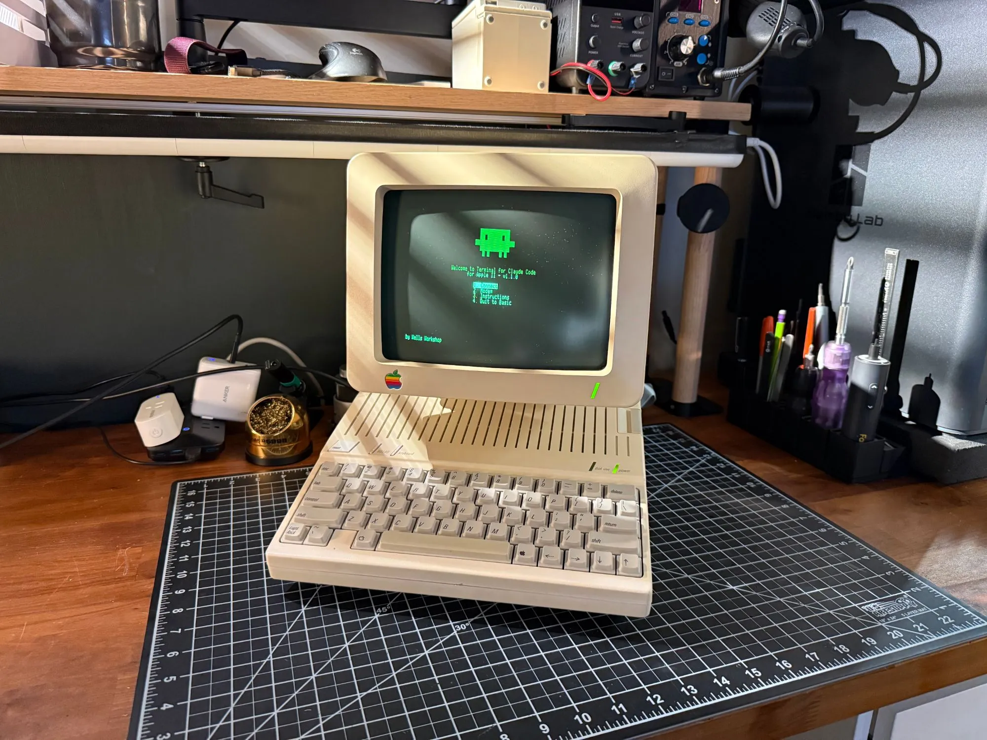An Apple IIc and its monitor seen from the front, at the Terminal for Claude Code menu